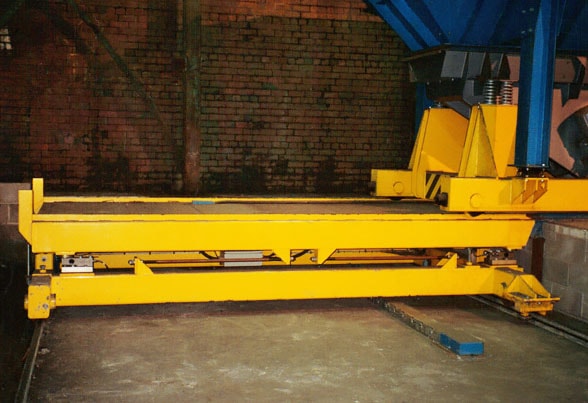 Indexing charger weighing carriage